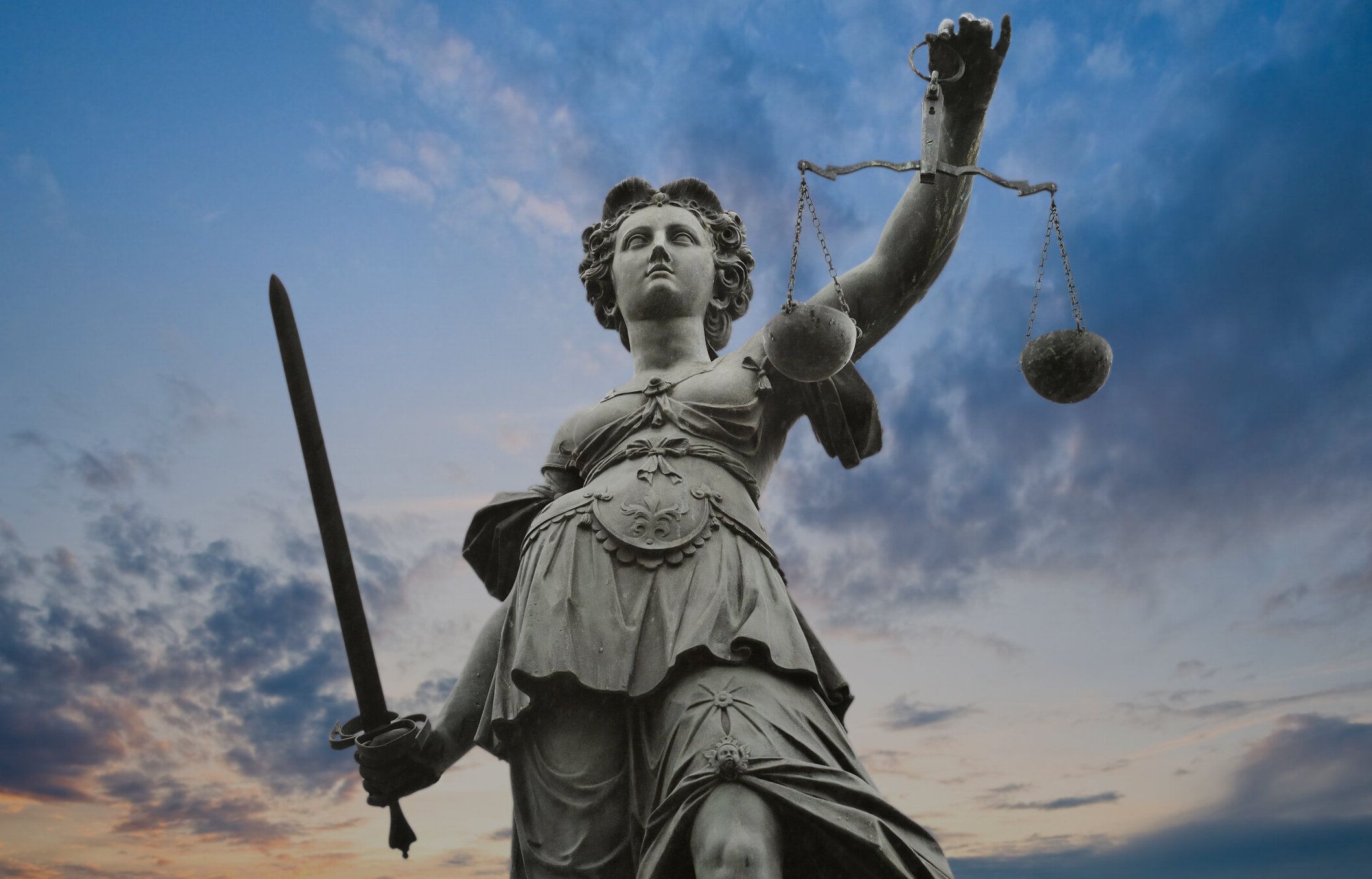 metal justice statue with sky in background in Frankfurt am Main, Germany