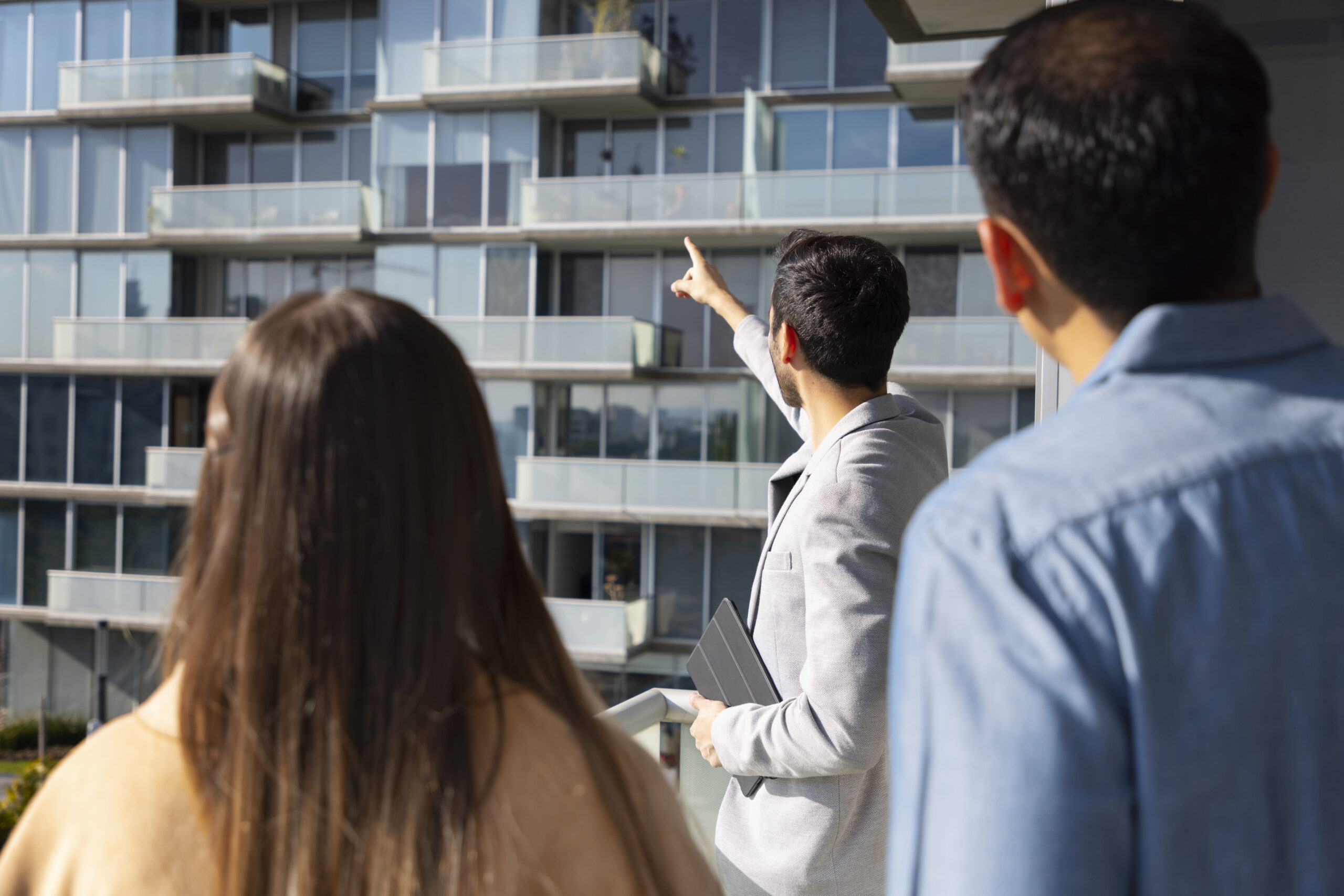 medium shot couple talking real estate agent