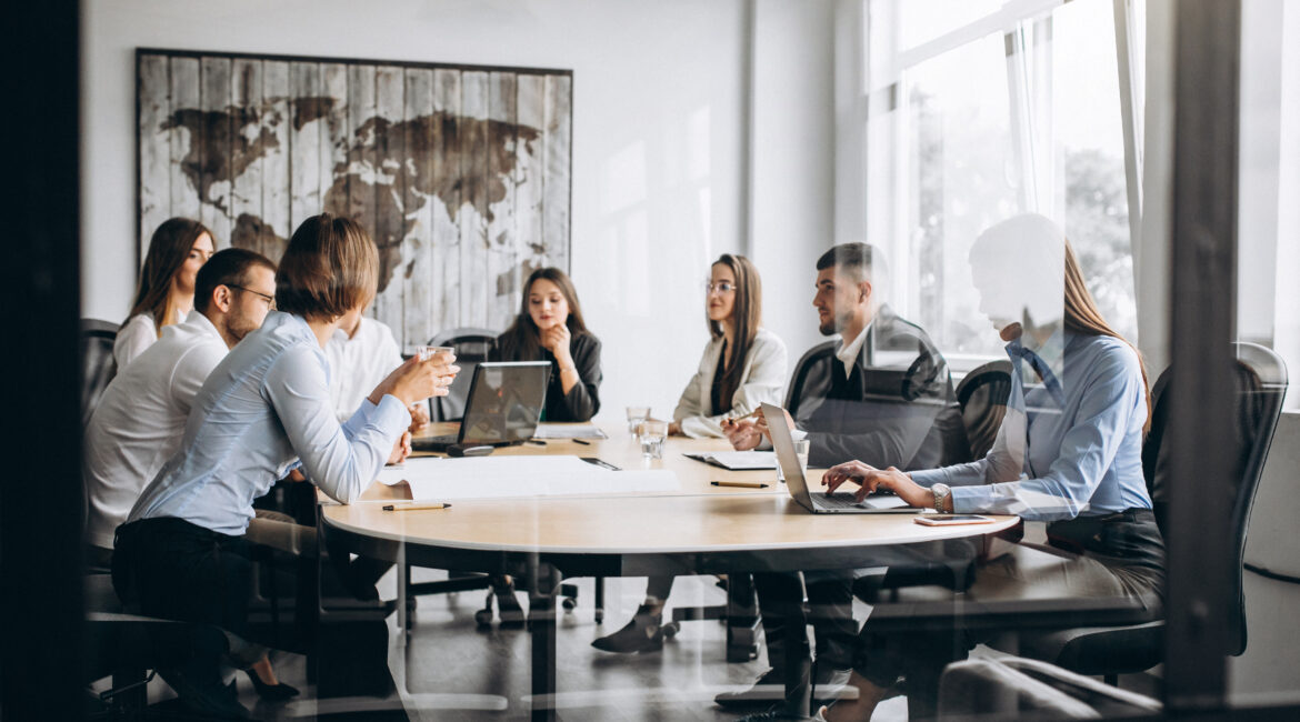 group of people working out business plan in an office